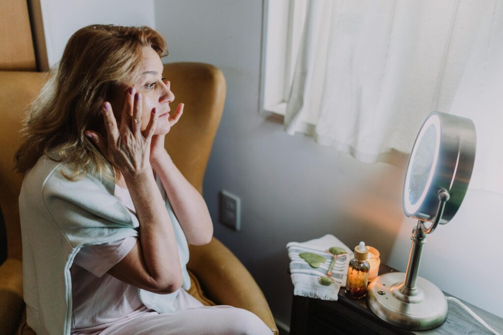 Woman experiencing relaxation with skincare routine at home. Peaceful and soothing atmosphere.